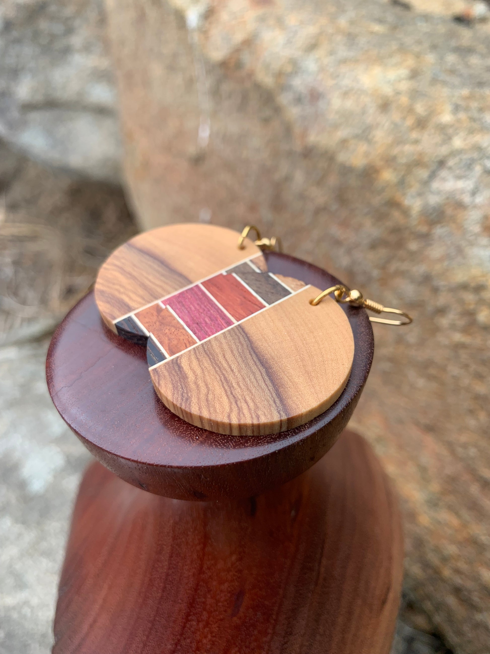 Dune Dream earrings, featuring handcrafted olive wood contrasted with multi-color desert woods like walnut, padauk, purple heart, wenge, and cherry.