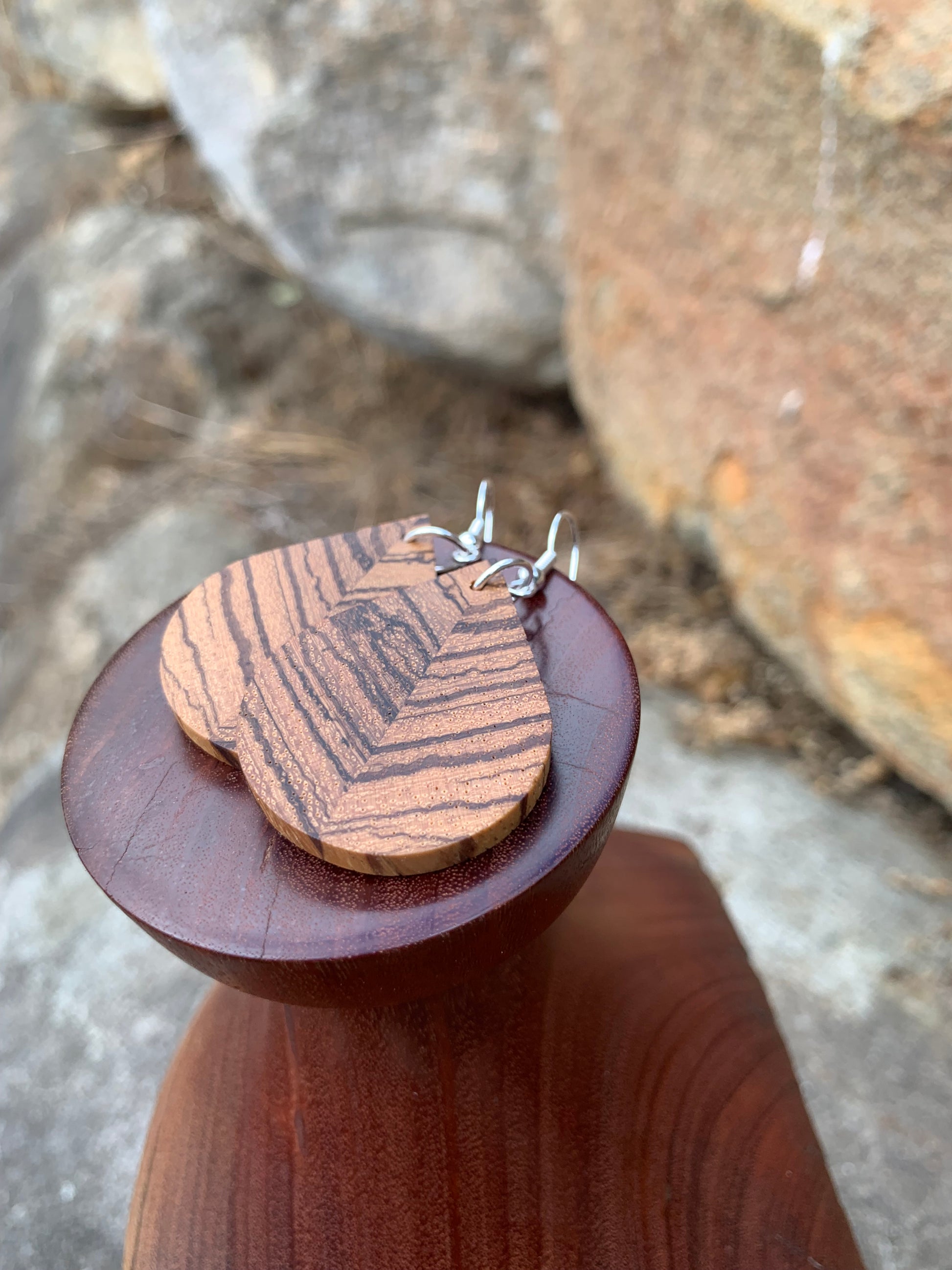 earring from bookmatched zebrano wood in the shape of a teardrop